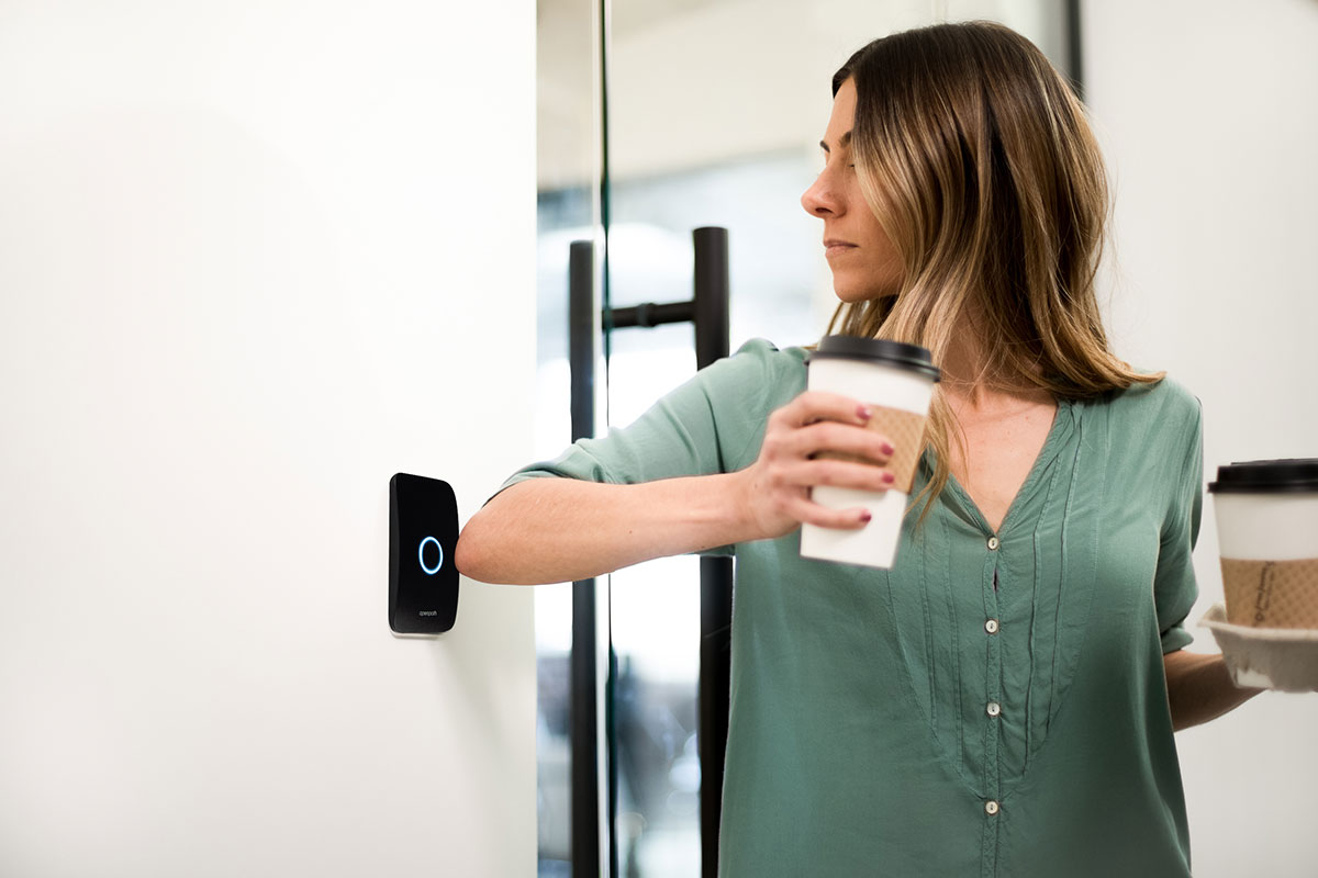 woman pressing a security button